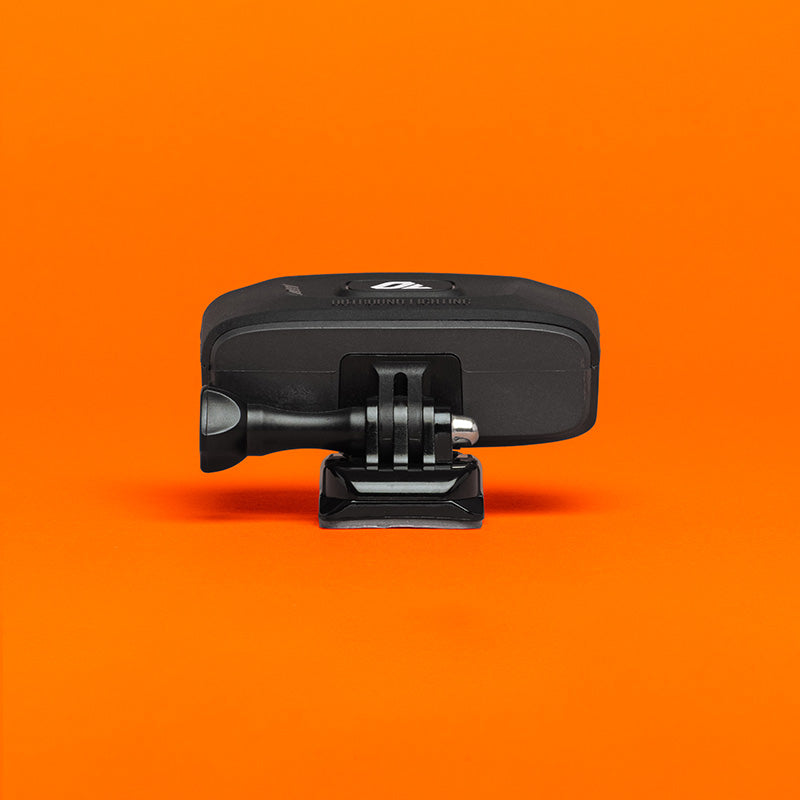 Portal bike helmet light rear view on its helmet mount, showing the action camera style mounting tabs